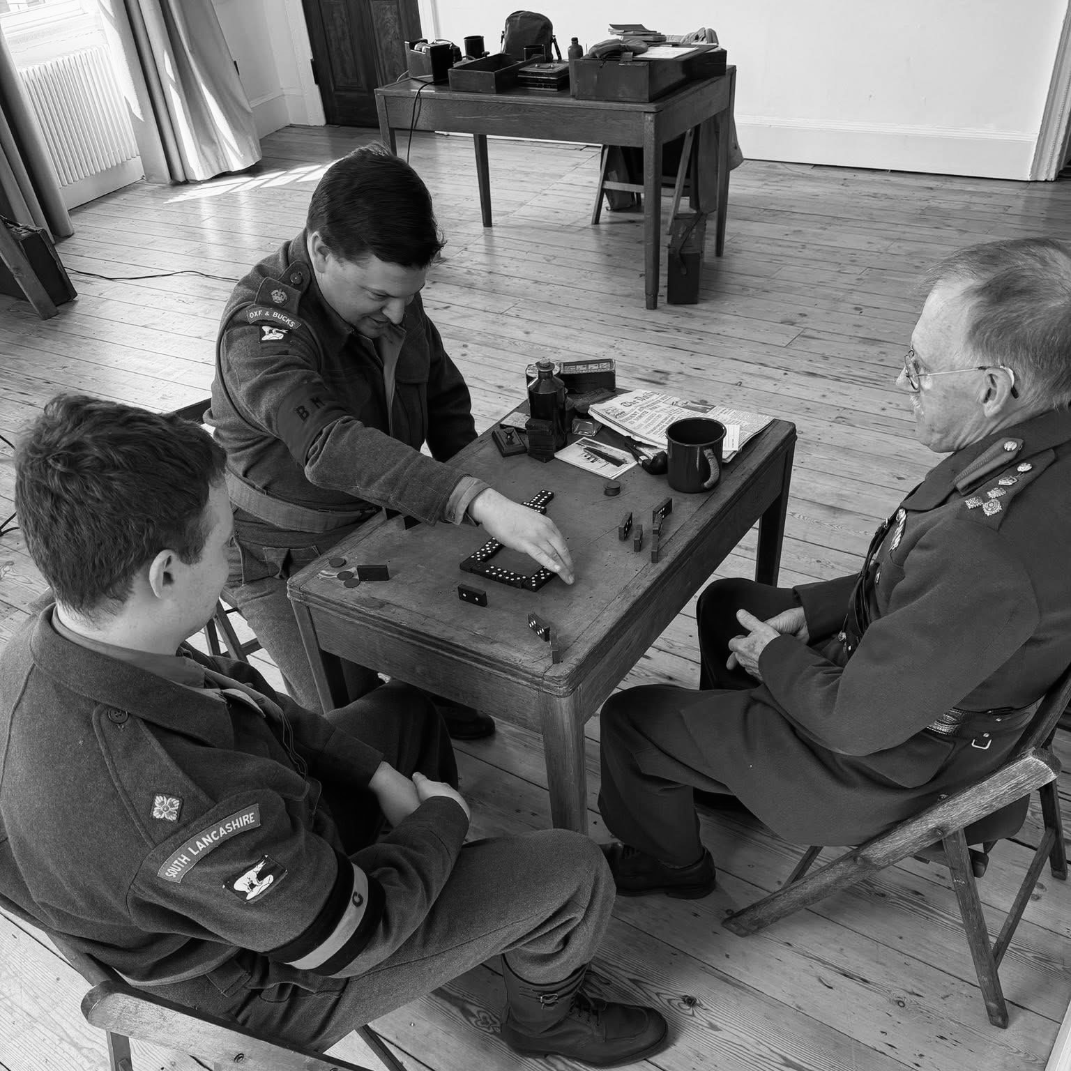 A friendly game of dominoes at Buxton 2026.